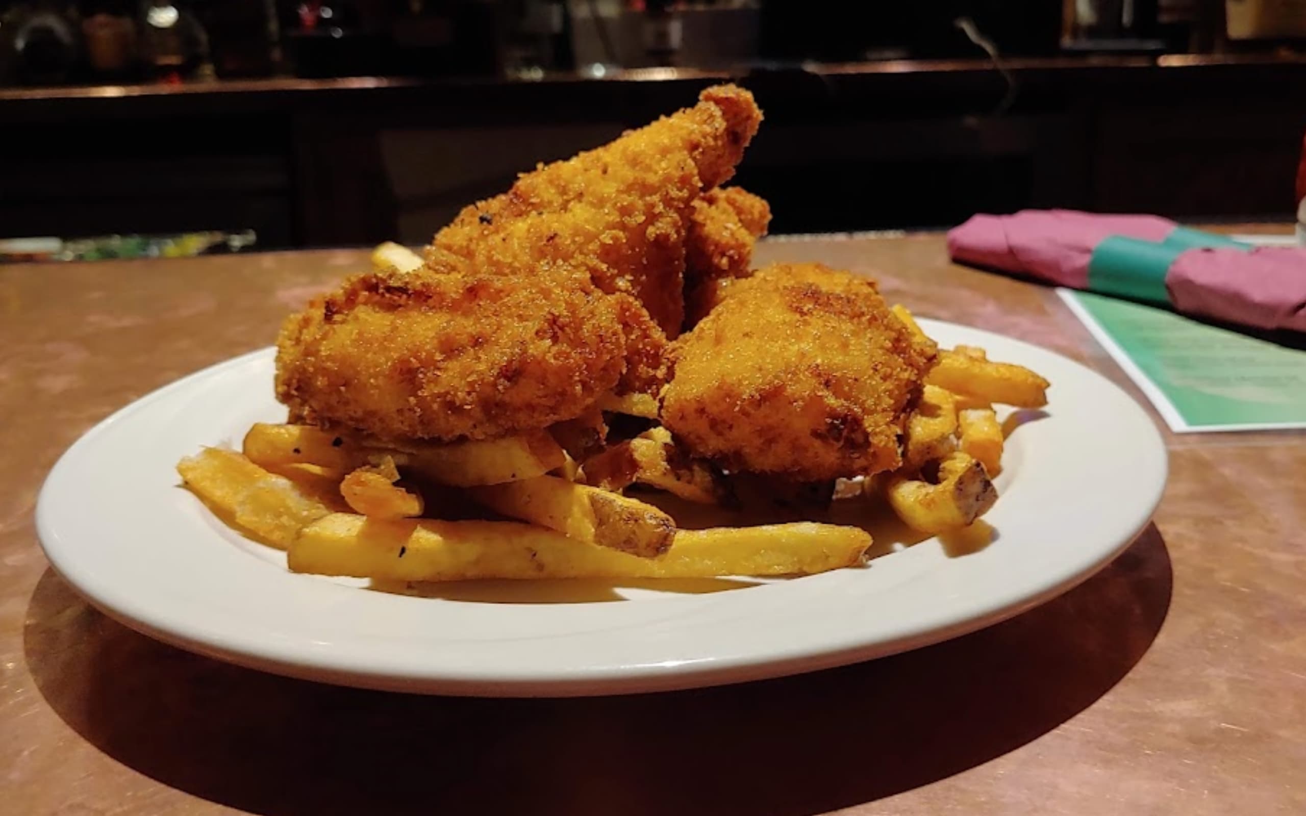 Fish and chips arrive fresh from the Cara Irish Pub kitchen.