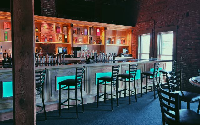 The Chameleon bar area is shown with customizable LED lighting and plenty of seating.