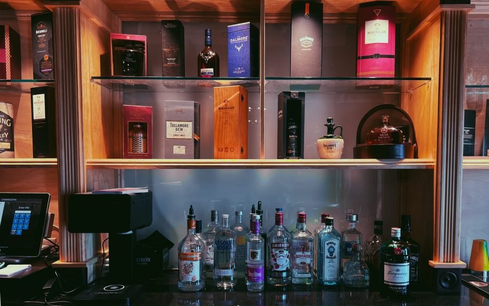 A closeup of the whiskey selection at the Chameleon bar is shown.