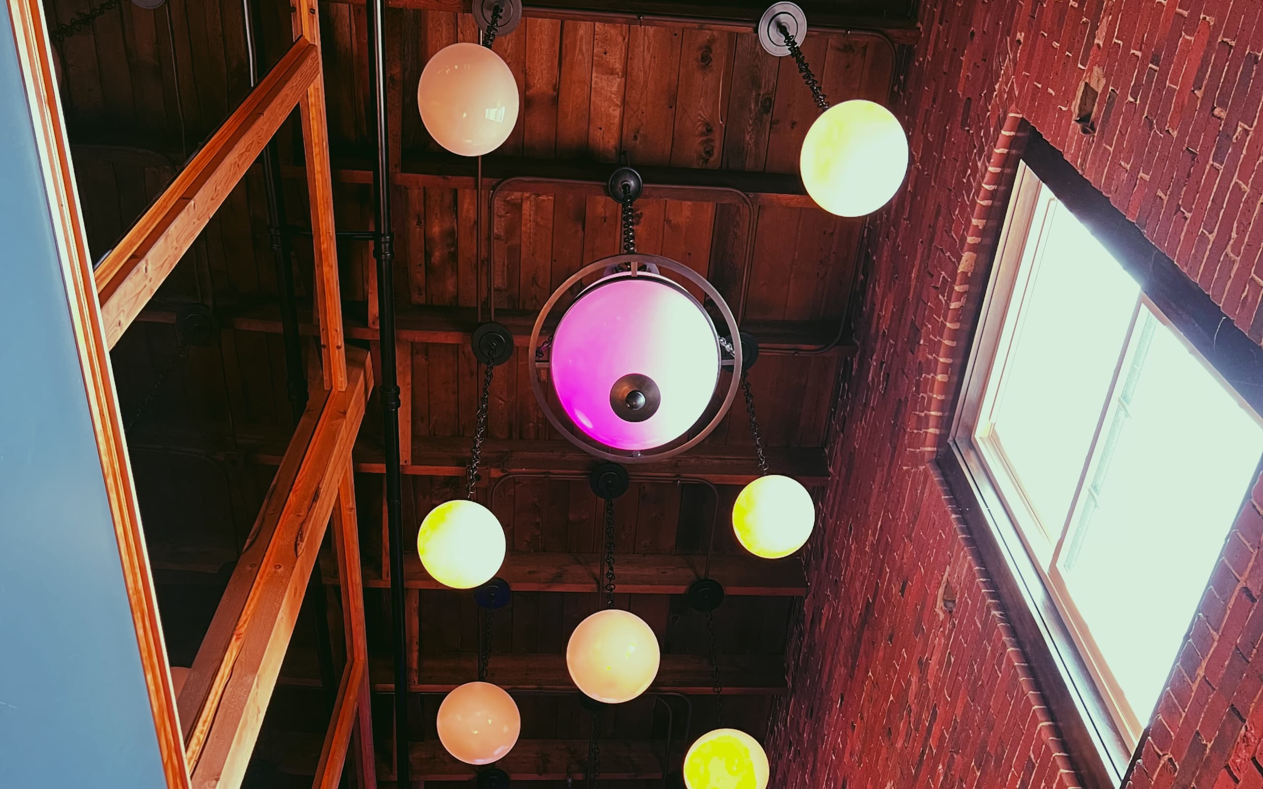 Customizable lights decorate the stairwell ceiling at Cara Irish Pub.